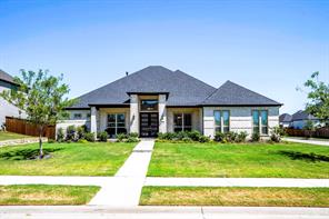 
Front elevation with trees and landscaped beds