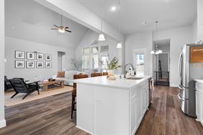 Butler's pantry with additional countertop space and glass front cabinets