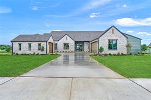 Double iron french doors and 3 car garage