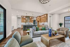 Vaulted ceiling with double wagon wheel chandelier