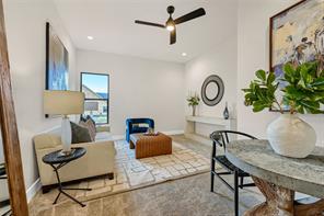 Game room with carpet, ceiling fan, & closet