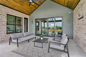 Back patio with sliding glass door, pre-wired for mounted TV & secuirty cameras