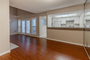 Unfurnished room with hardwood / wood-style flooring and a textured ceiling