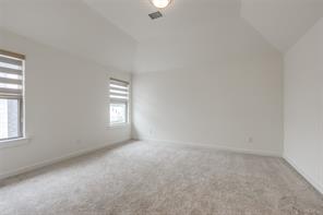 Full bathroom with tile patterned flooring, vanity, toilet, and tiled shower / bath