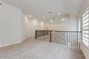 Spare room featuring carpet flooring