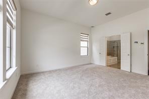 Bathroom with tile patterned flooring, an enclosed shower, and vanity