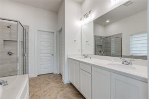 Bathroom featuring separate shower and tub and tile patterned floors