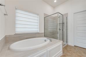 Bathroom featuring vanity, toilet, vaulted ceiling, and tile patterned flooring