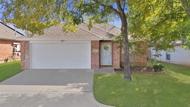 Ranch-style home with a front lawn