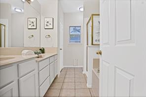 Bathroom featuring tile patterned flooring, toilet, and a shower with shower door