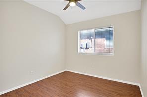 Unfurnished bedroom with dark hardwood / wood-style floors, ceiling fan, and a closet