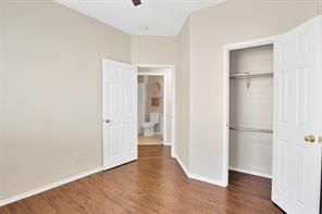 Full bathroom with tiled shower / bath, vanity, tile patterned flooring, and toilet