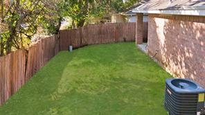 View of yard with a balcony