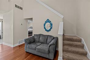 Carpeted bedroom featuring a textured ceiling and ceiling fan