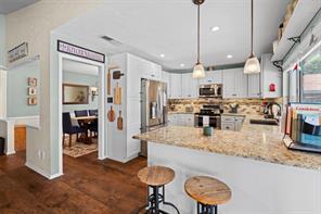 Dining room featuring a chandelier and dark hardwood / wood-style floors