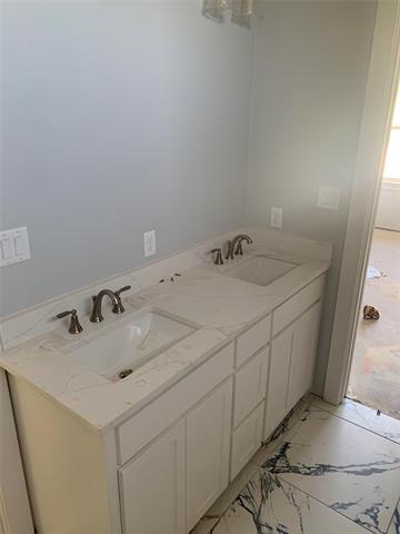 Bathroom with vanity and tiled shower / bath combo