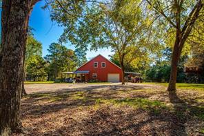 Surrounding community with a water view and a yard