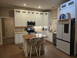 Dining area featuring crown molding, french doors, and plenty of natural light