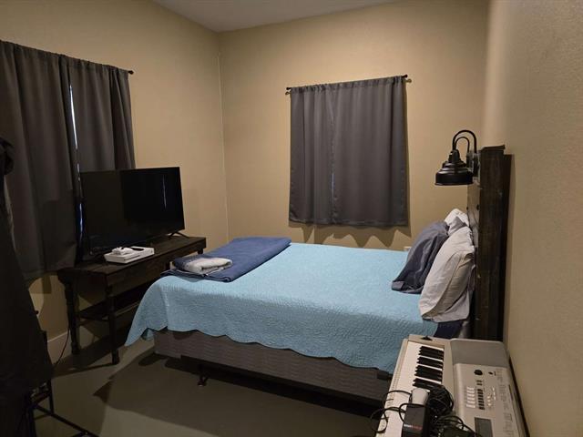 Office featuring lofted ceiling, dark hardwood / wood-style floors, and wooden ceiling