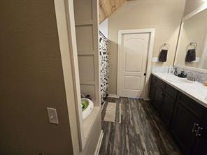 Bathroom with shower / bath combo with shower curtain and wood ceiling