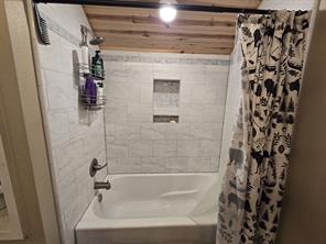 Bathroom featuring wood ceiling, hardwood / wood-style floors, and toilet