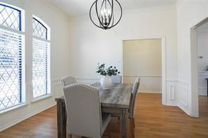 Kitchen featuring decorative backsplash, dark stone countertops, appliances with stainless steel finishes, and sink