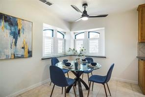 Home office featuring ornamental molding, lofted ceiling, ceiling fan, and dark hardwood / wood-style flooring