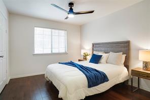 Unfurnished room featuring ornamental molding, ceiling fan, and dark hardwood / wood-style floors