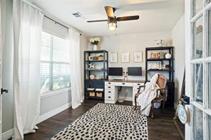 Bathroom featuring a textured ceiling, vaulted ceiling, and toilet