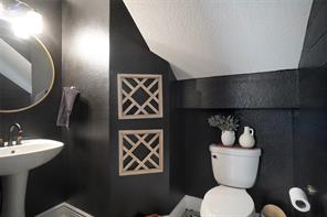 Bedroom with wood-type flooring, vaulted ceiling, and ceiling fan